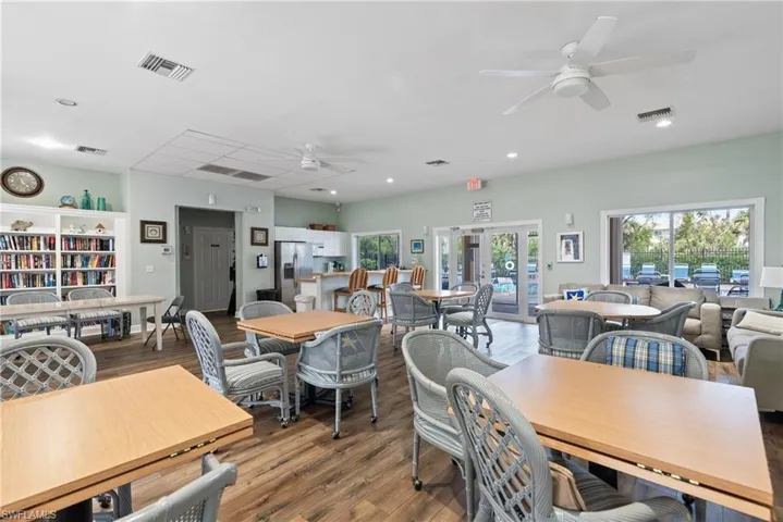 Dining room featuring ceiling fan, wood finished floors, and recessed lighting