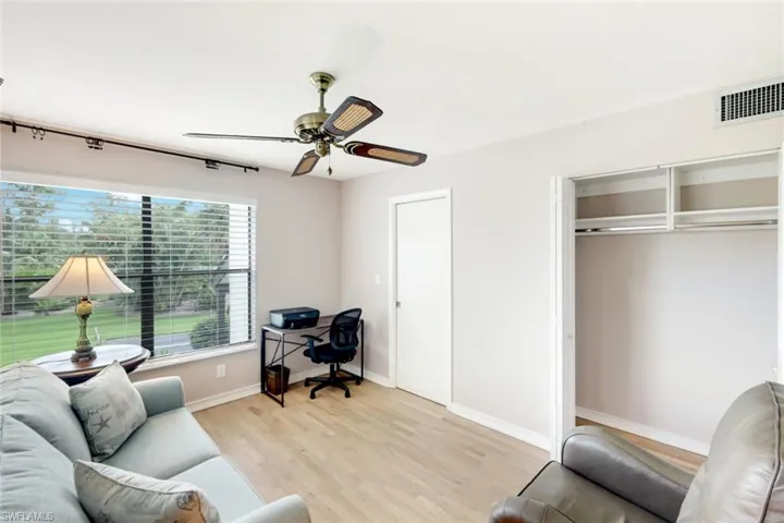 Guest Bedroom III- Shown With Closet Open- Multiple Uses- View From Side Window to the Community Pool Area