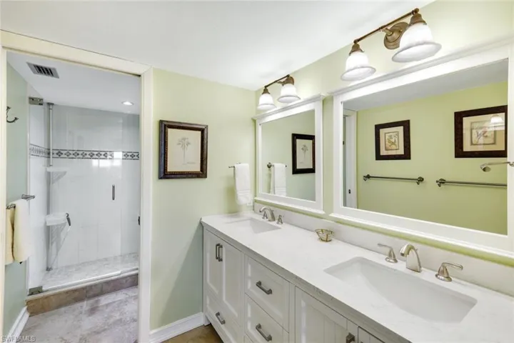 View Into Large Step In Shower with Heavy Glass Slider Doors- Custom Mirrors Stay As Well