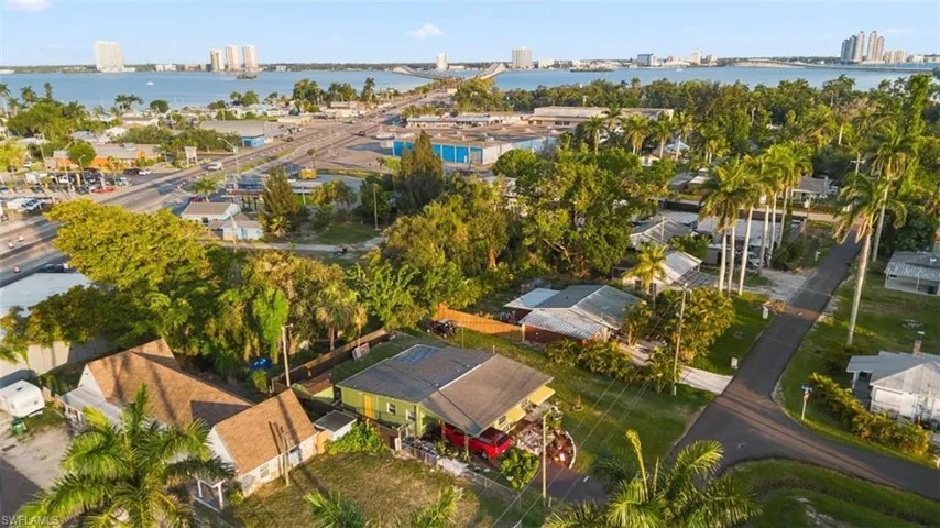 Drone / aerial view of a nearby body of water and a notable bridge