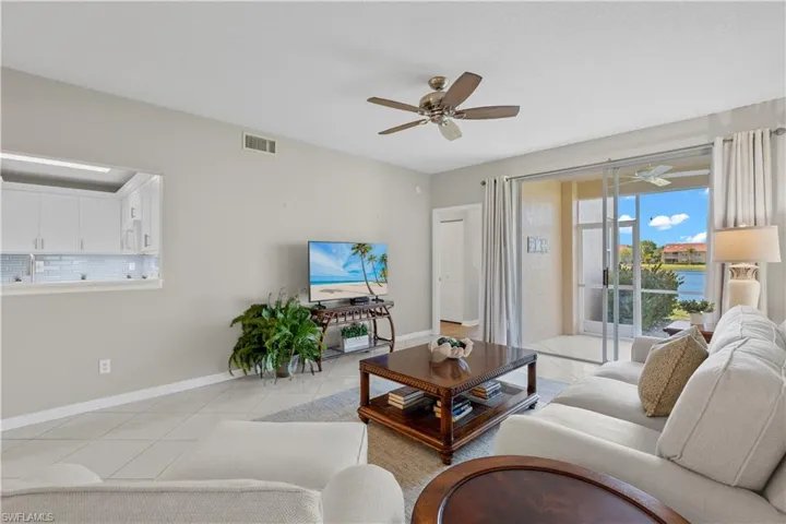 Living Room with Ceiling Fan and Uplighting