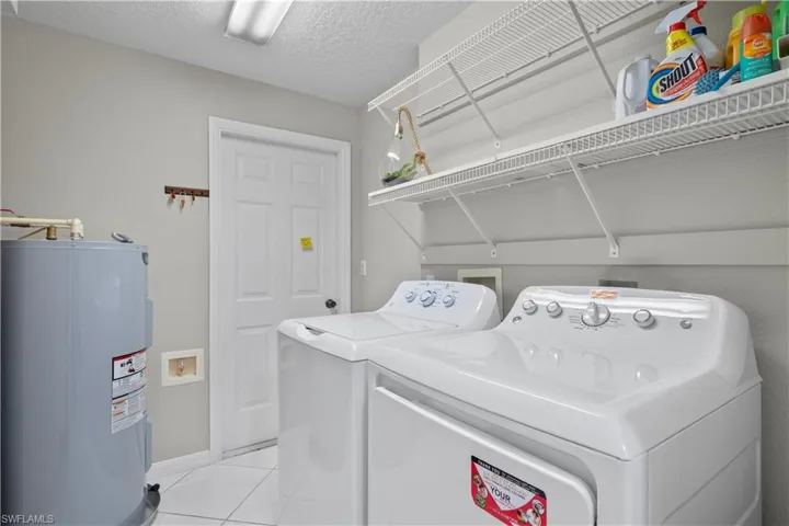 Laundry Room with NEW Washer and Dryer and Garage Entrance