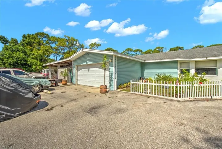 View of property exterior with a garage