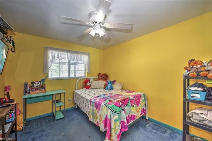 Bedroom featuring carpet flooring and ceiling fan