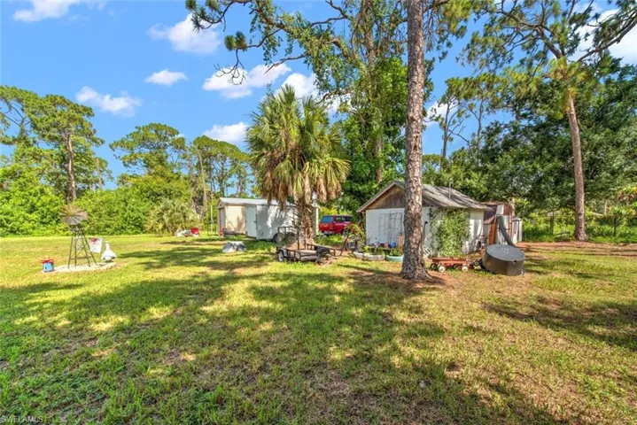 View of yard with a storage shed