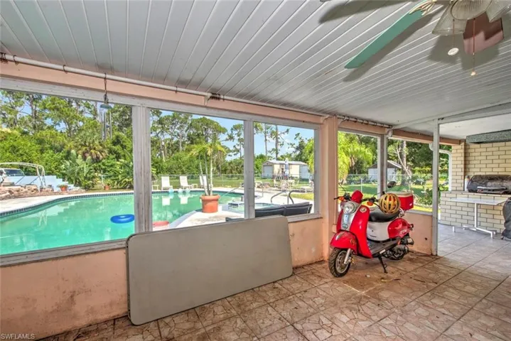View of swimming pool with ceiling fan