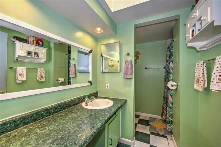 Bathroom with vanity and tile patterned flooring