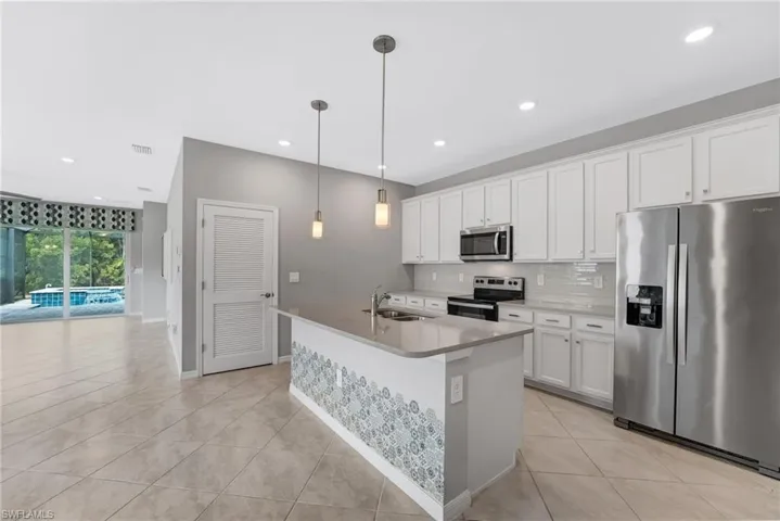 A spacious center island offers the perfect place for casual meals, prep space, and entertaining.