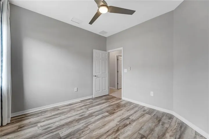 A comfortable guest bedroom offers privacy and flexibility for family or visitors.