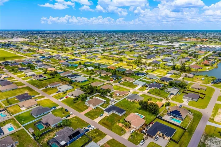 Aerial view of residential area with a nearby body of water