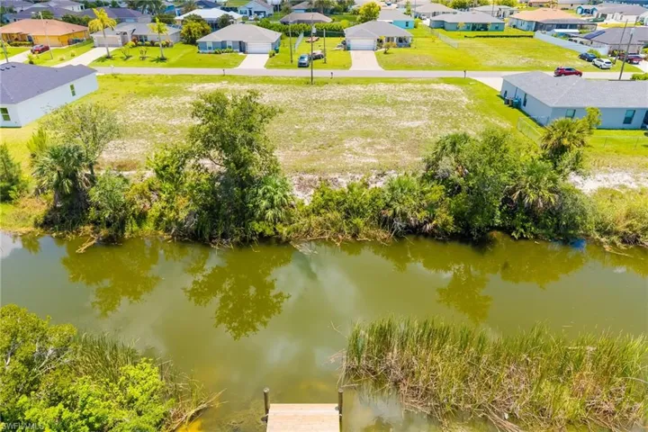 Honeymoon Lake 1501 NW 2ND St, Cape Coral, FL 33993. This lot is centrally located with all your essentials nearby, schools, restaurants, I41 and I75, proximity to Sanibel, Siesta Key, Pine Island, Fort Myers, Sarasota.Bring your fishing rod and sit by the dock and fish for your own quiet enjoyment on Nova Canal leading out to Honeymoon Lake.
