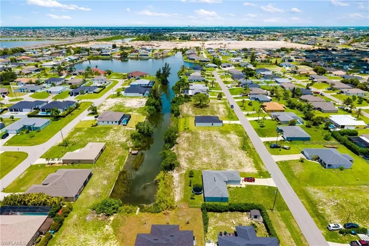 Waterfront Jewel canal front lot leads out to Honeymoon Lake 1501 NW 2ND St, Cape Coral, FL 33993. This lot is centrally located with all your essentials nearby, schools, restaurants, I41 and I75, proximity to Sanibel, Siesta Key, Pine Island, Fort Myers, Sarasota.