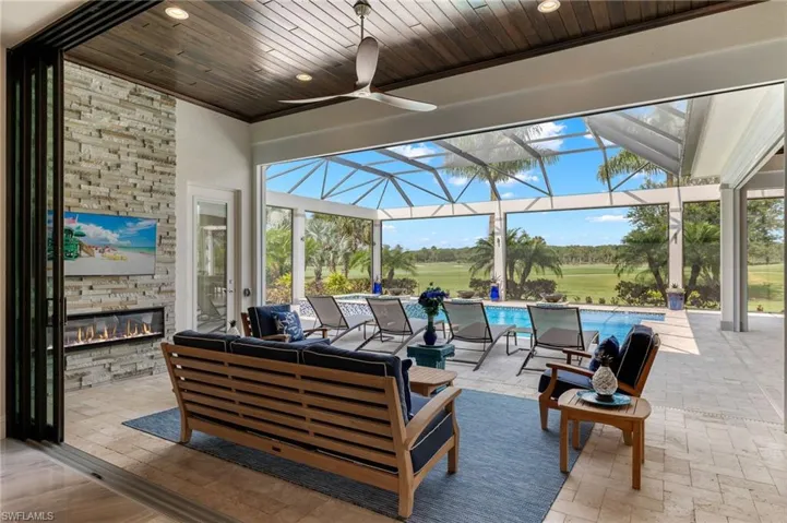 View of patio featuring ceiling fan, enclosure, and outdoor lounge area