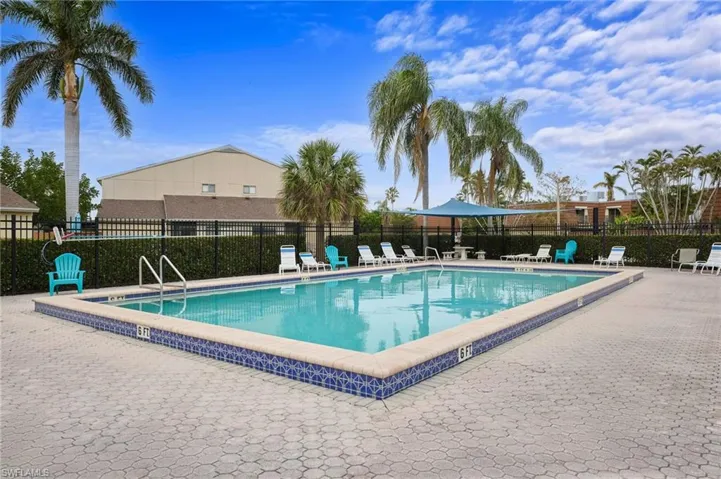 Community pool featuring a patio