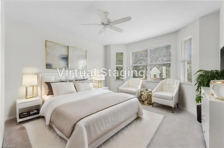 Master bedroom with ceiling fan and light carpet