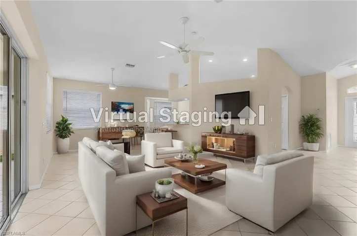 Living room featuring plenty of natural light, ceiling fan, and light tile patterned floors. Photo is AI generated