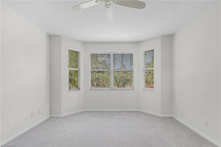 Master bedroom unfurnished room with ceiling fan and light new carpet