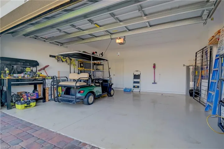 Garage with water heater and a garage door opener