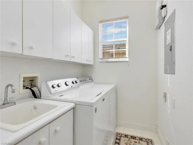 Laundry Room with nice cabinet space for storage
