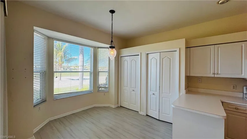 Sunny breakfast nook with large windows for natural light.