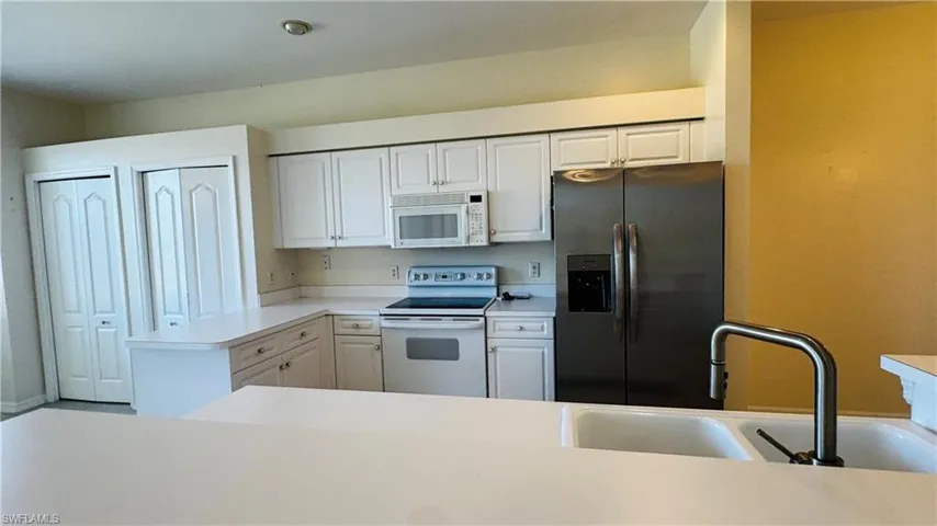 Spacious kitchen with plenty of counter space and storage.