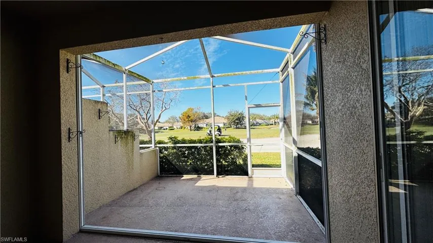 Bright Florida sun room--perfect place to relax and enjoy the sunshine and golf course view of the 6th Fairway.