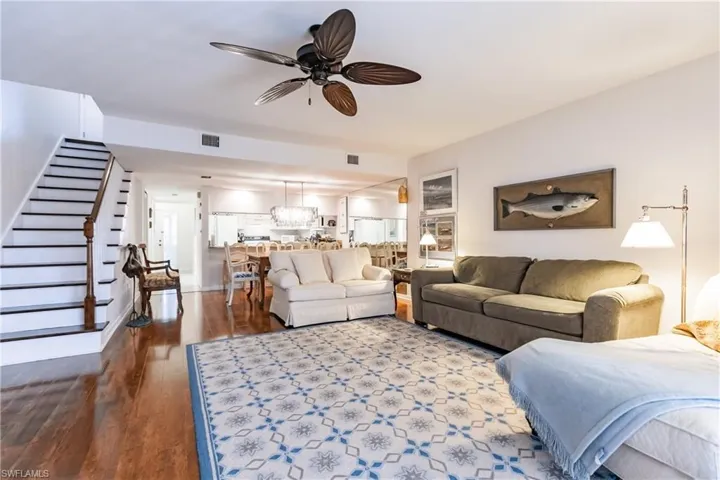 Living room featuring hardwood / wood-style flooring and ceiling fan
