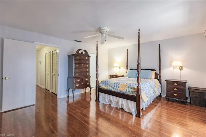 Bedroom featuring hardwood / wood-style floors and ceiling fan