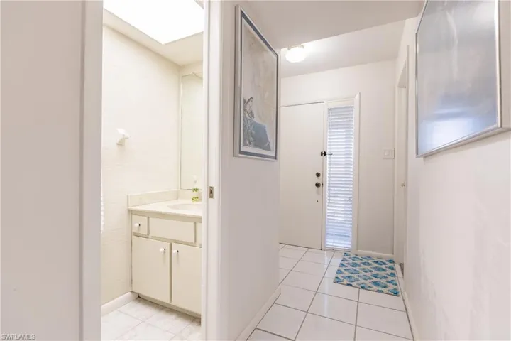 Bathroom featuring tile patterned flooring and vanity