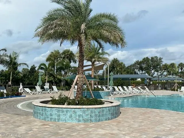 Community pool with a patio area