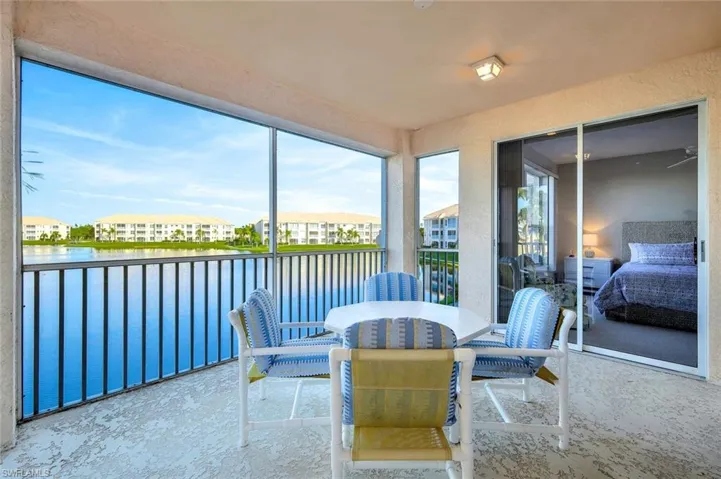 Sunroom / solarium with a water view