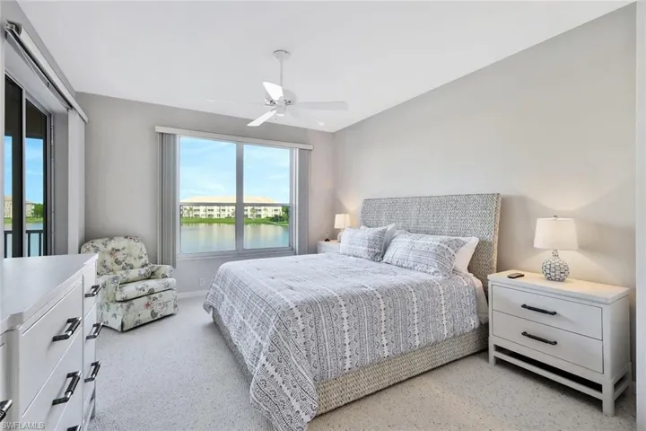 Bedroom featuring a water view and ceiling fan