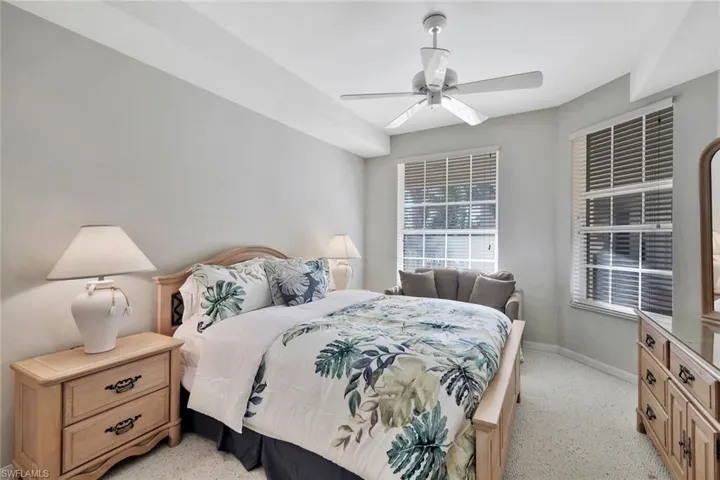 Bedroom with baseboards and a ceiling fan
