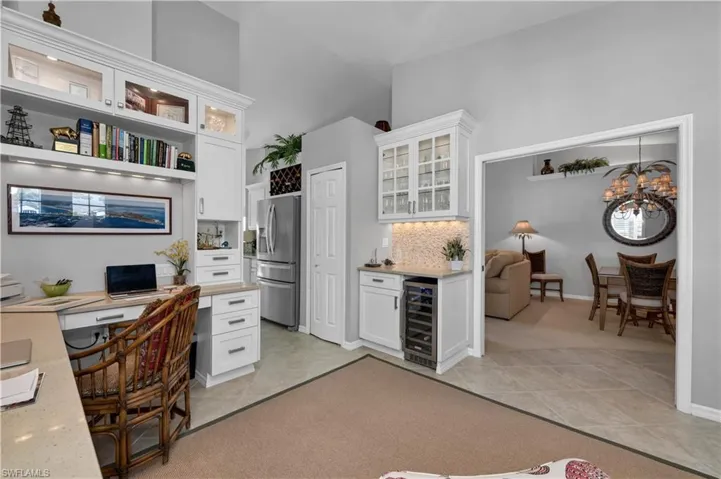 den to dining room including custom bar area