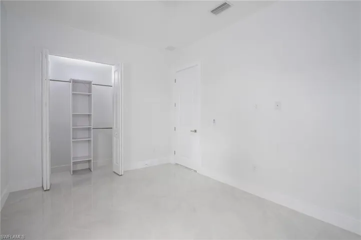 Unfurnished bedroom featuring baseboards