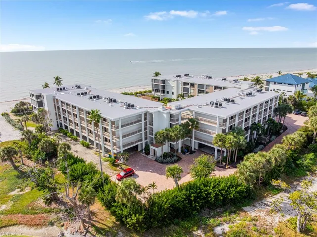 Aerial view of apartment complex and a large body of water
