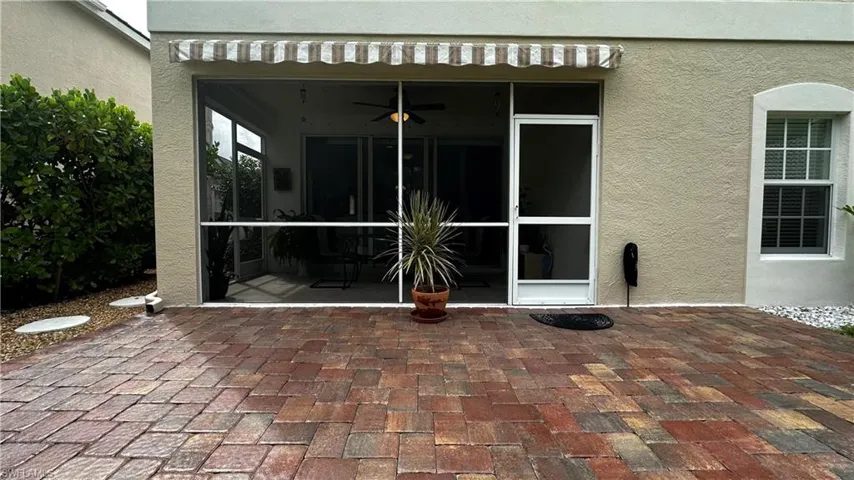 View of patio with ceiling fan