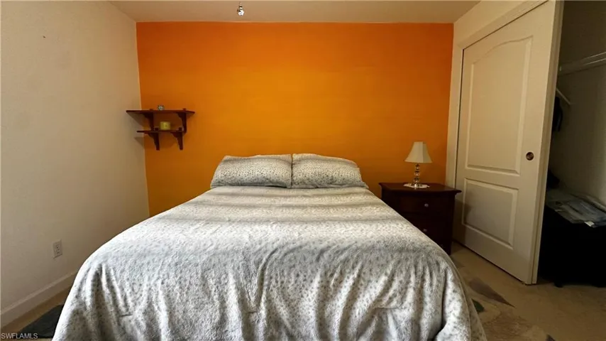 Bedroom with carpet floors and a closet