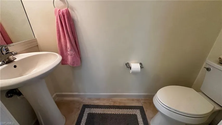 Bathroom featuring tile patterned floors and toilet