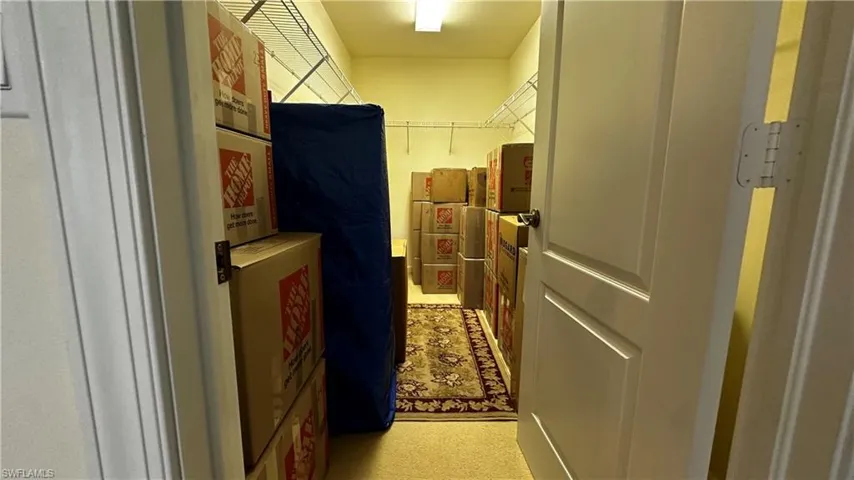 Hallway with light carpet