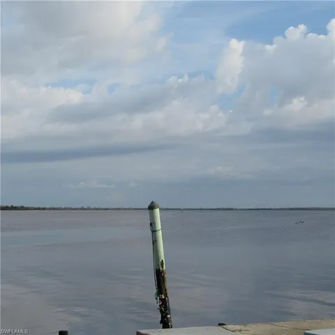View of water feature with a boat dock