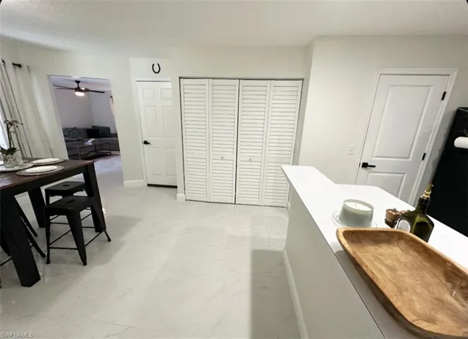 Bathroom featuring tile flooring and ceiling fan