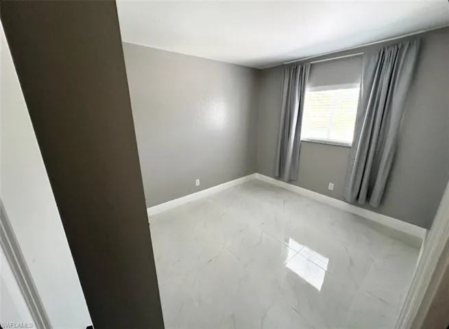 View of tiled spare room