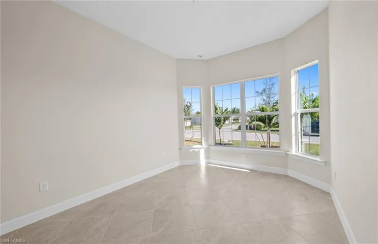 Empty room featuring baseboards