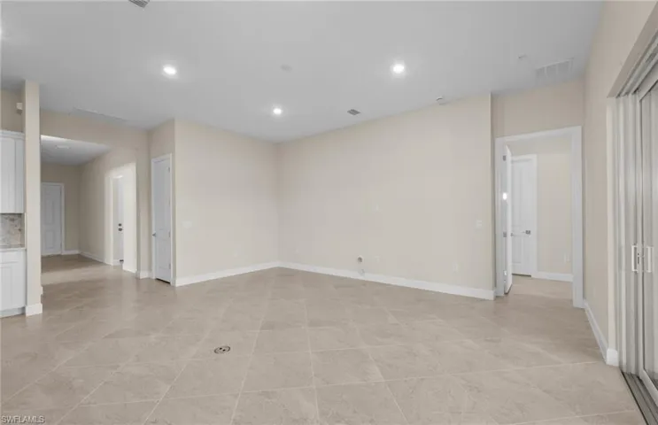 Empty room featuring recessed lighting and baseboards