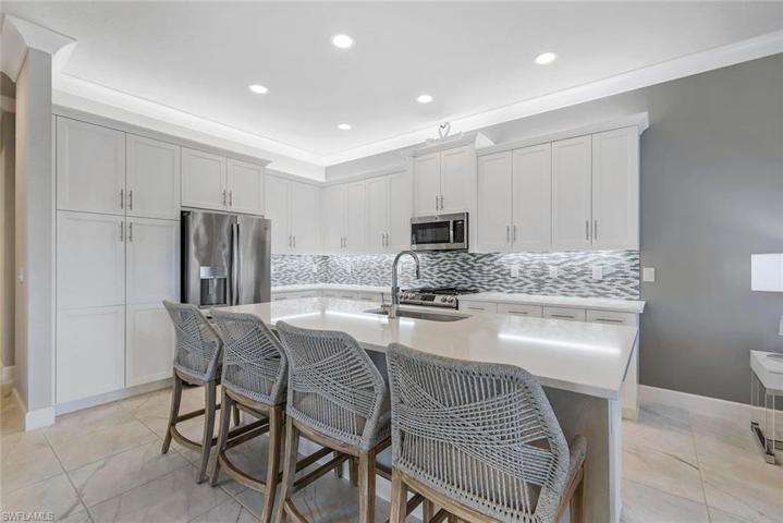 Notice the large pantry alongside the refrigerator.