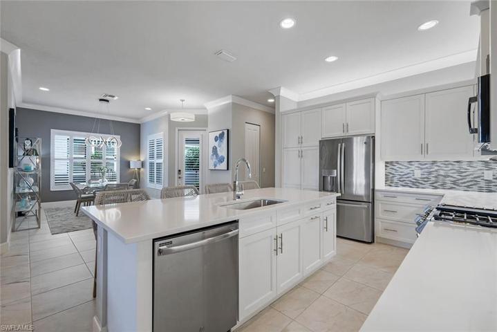 View of dining room and entry way from the kitchen.