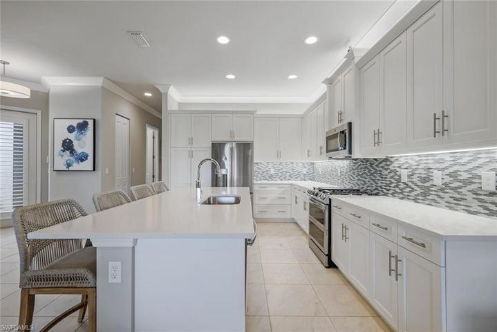 So many cabinets, a double oven, and a custom backsplash.
