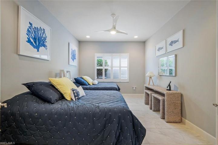Den is SO SPACIOUS, it is currently being used as an additional guest room fitting two queen beds.