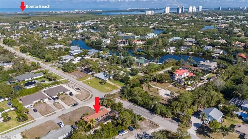 Aerial view featuring a residential view and a water view